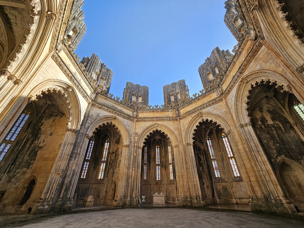 a view of the inside of a cathedral looking up at the sky