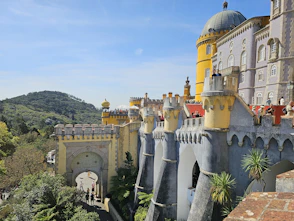 a castle like building with a yellow roof