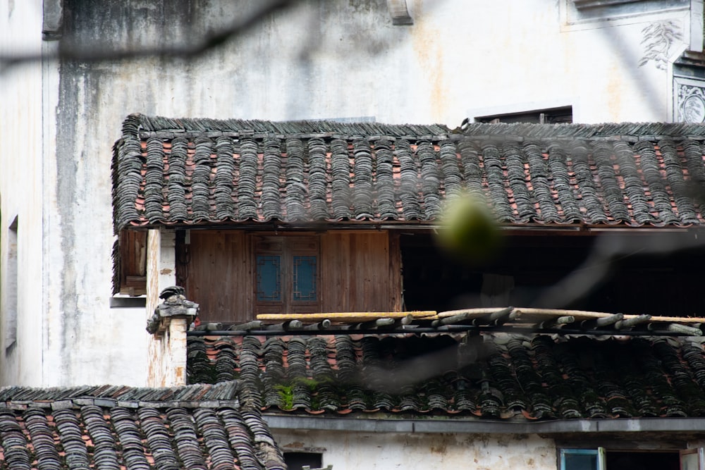 a building with a tiled roof and a wooden door