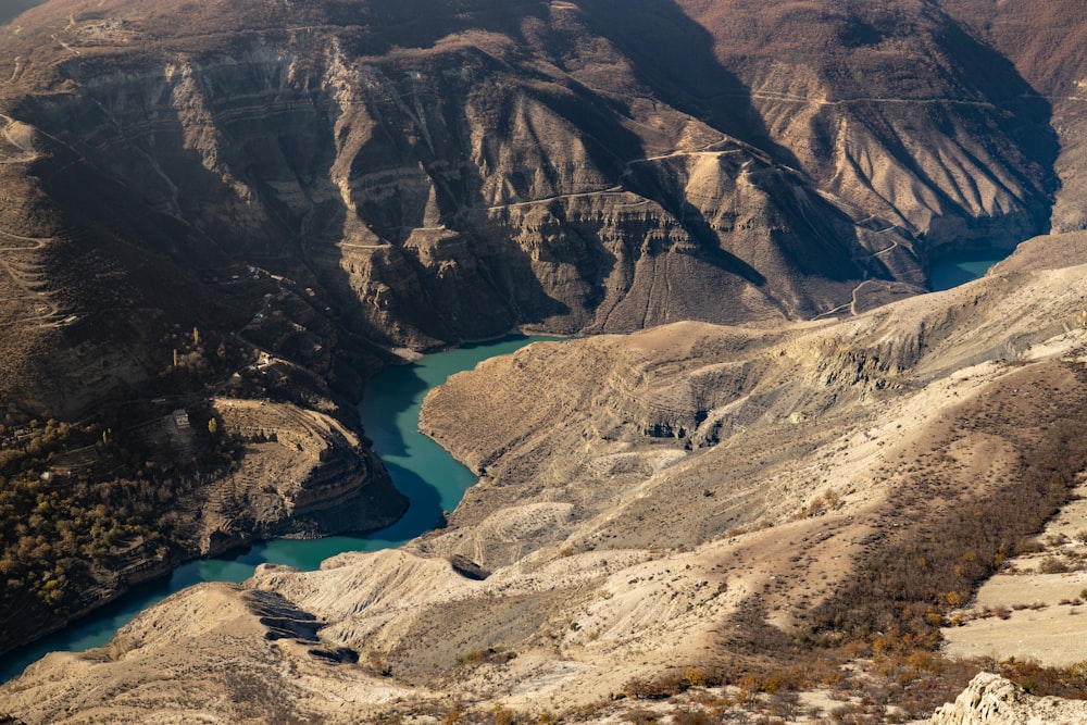 a view of a canyon with a river running through it