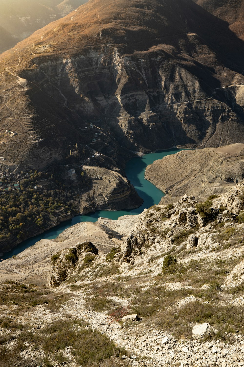 a man riding a horse on top of a mountain