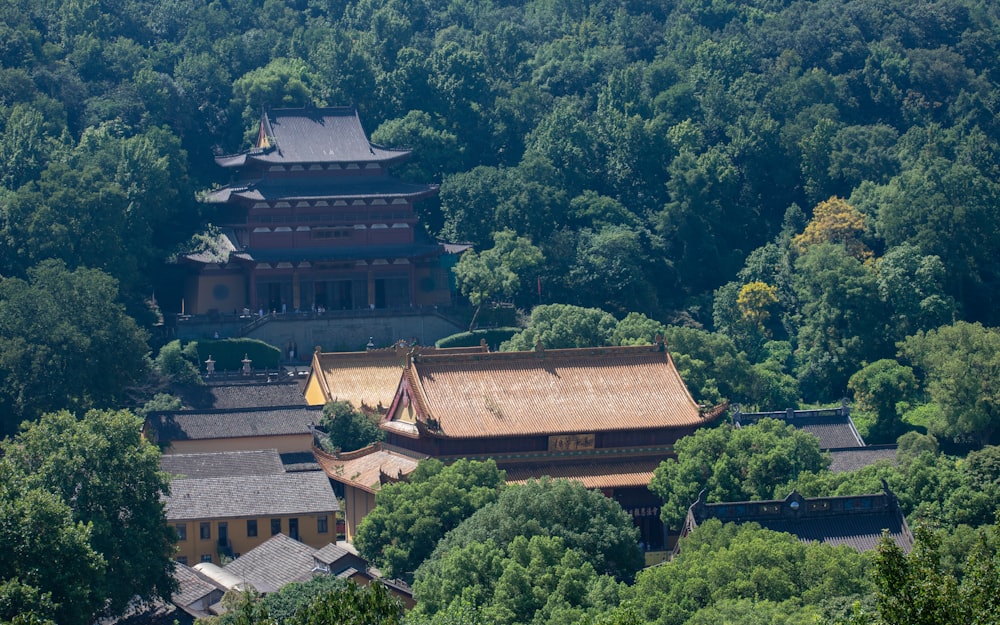 an aerial view of a building surrounded by trees