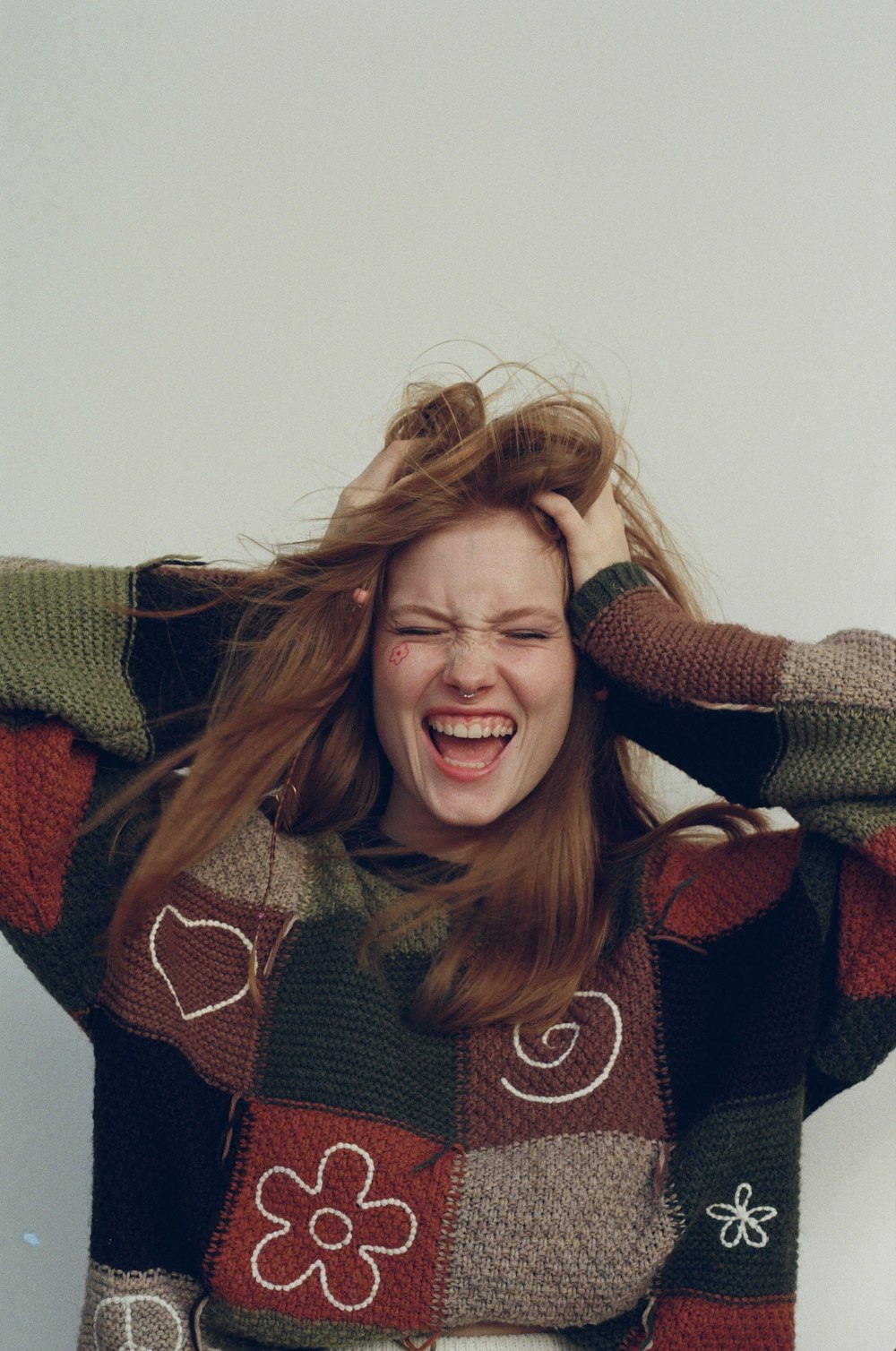 a woman with her hair in the wind