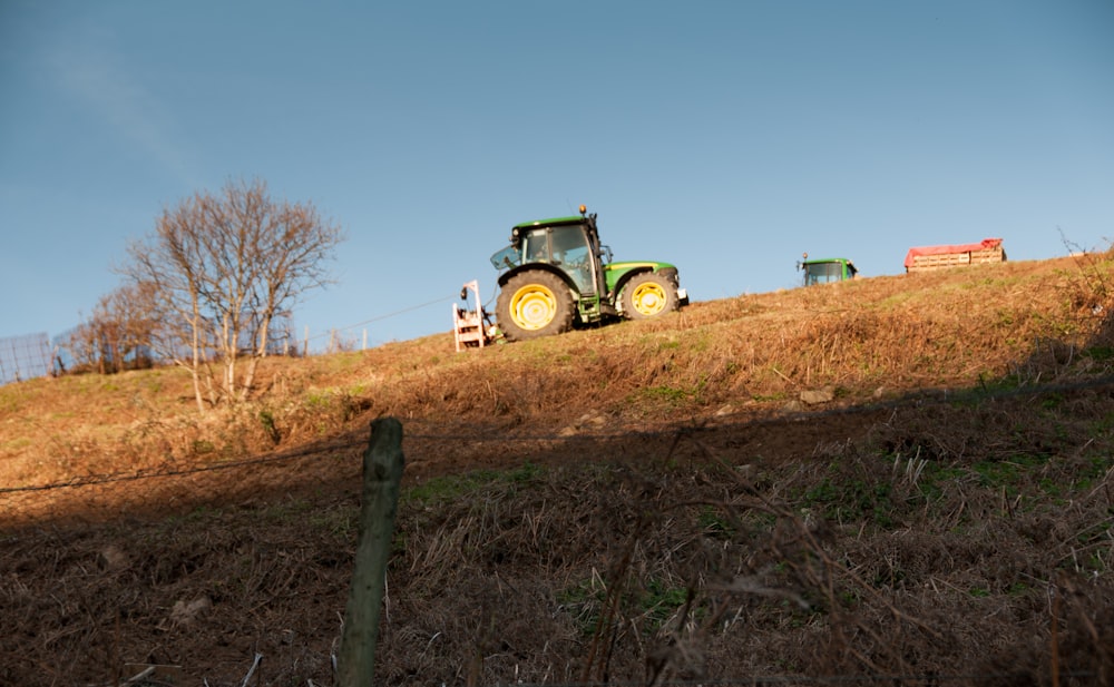 a tractor is driving down a hill on a clear day