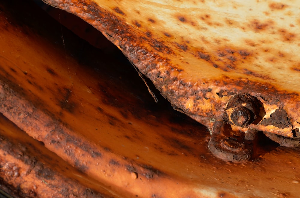 a close up of a rusted metal object