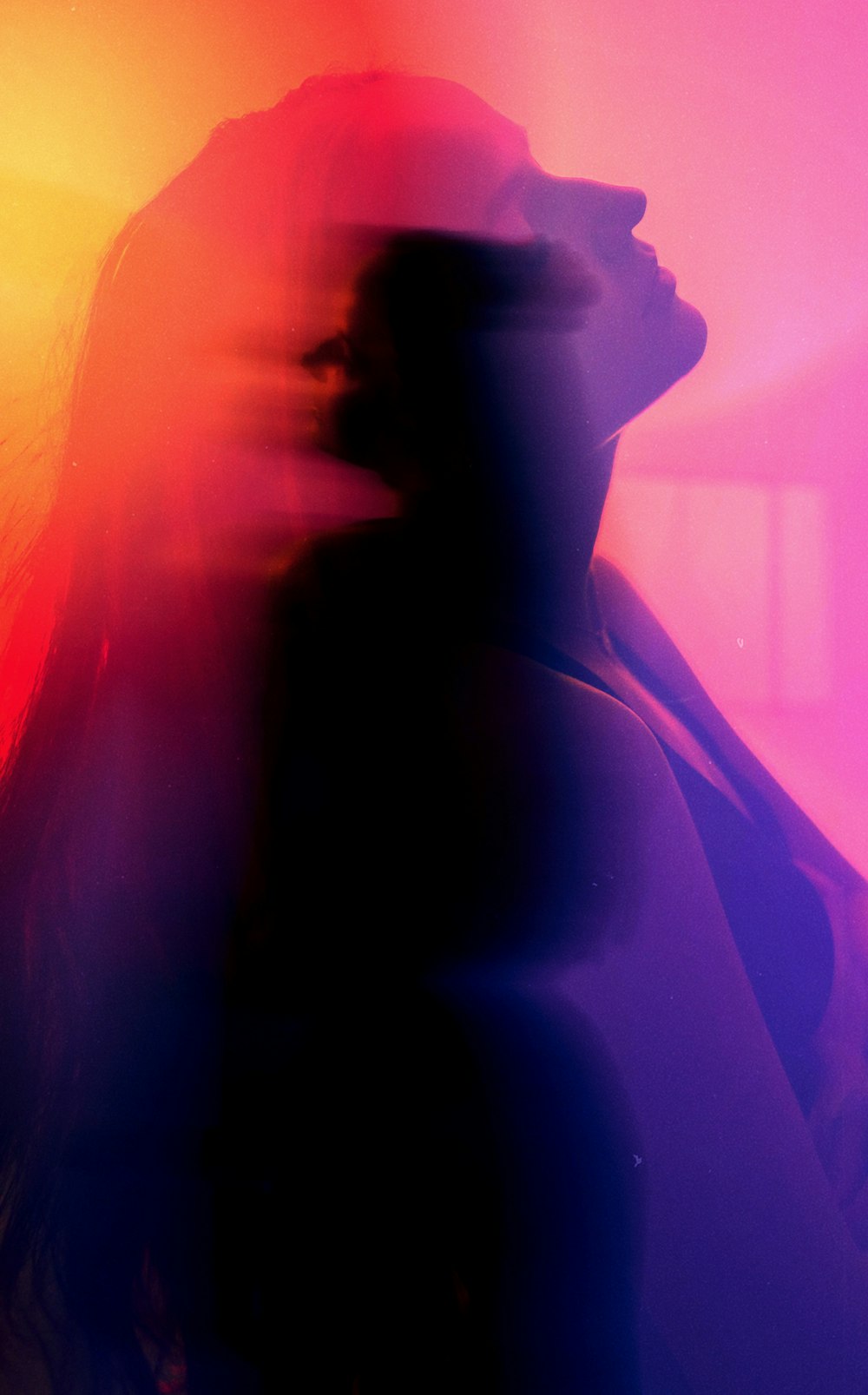 a blurry photo of a woman's face and hair