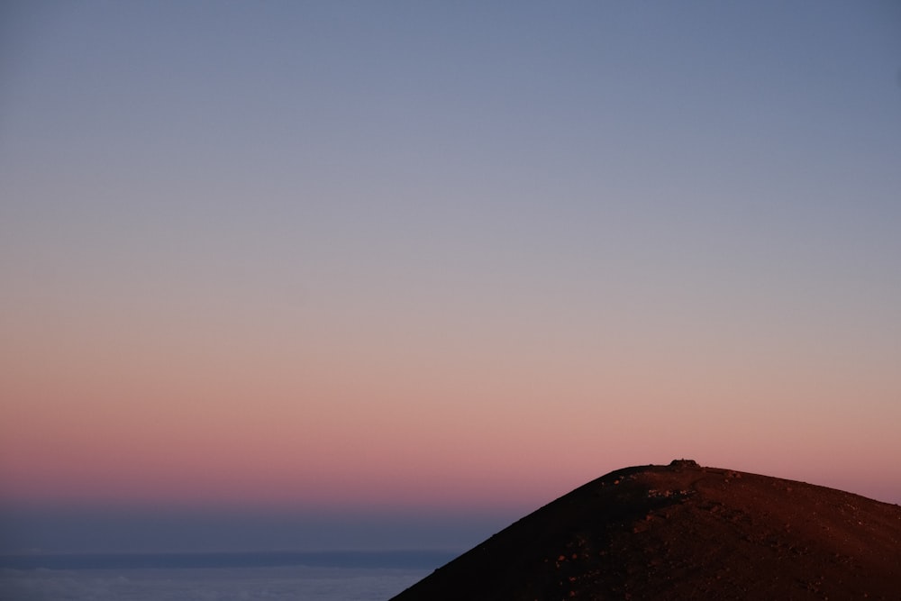 a person standing on top of a hill