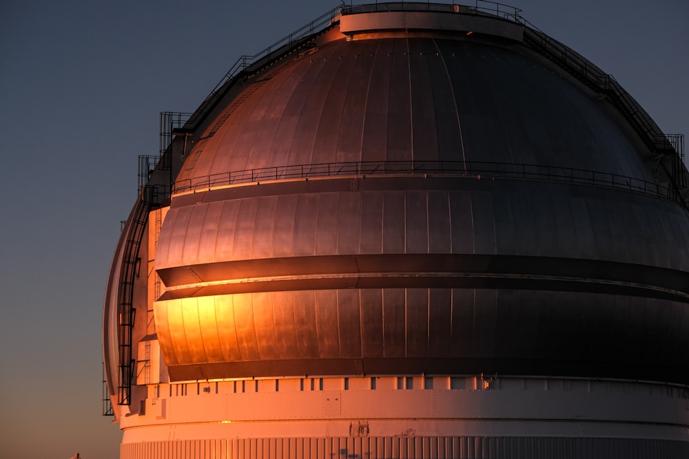 a very large dome with a sky in the background