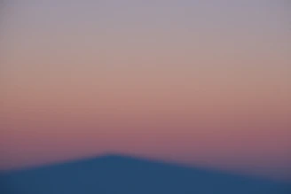 Abstract violet-pink gradient overlay on a blurred office scene symbolizing ai governance.