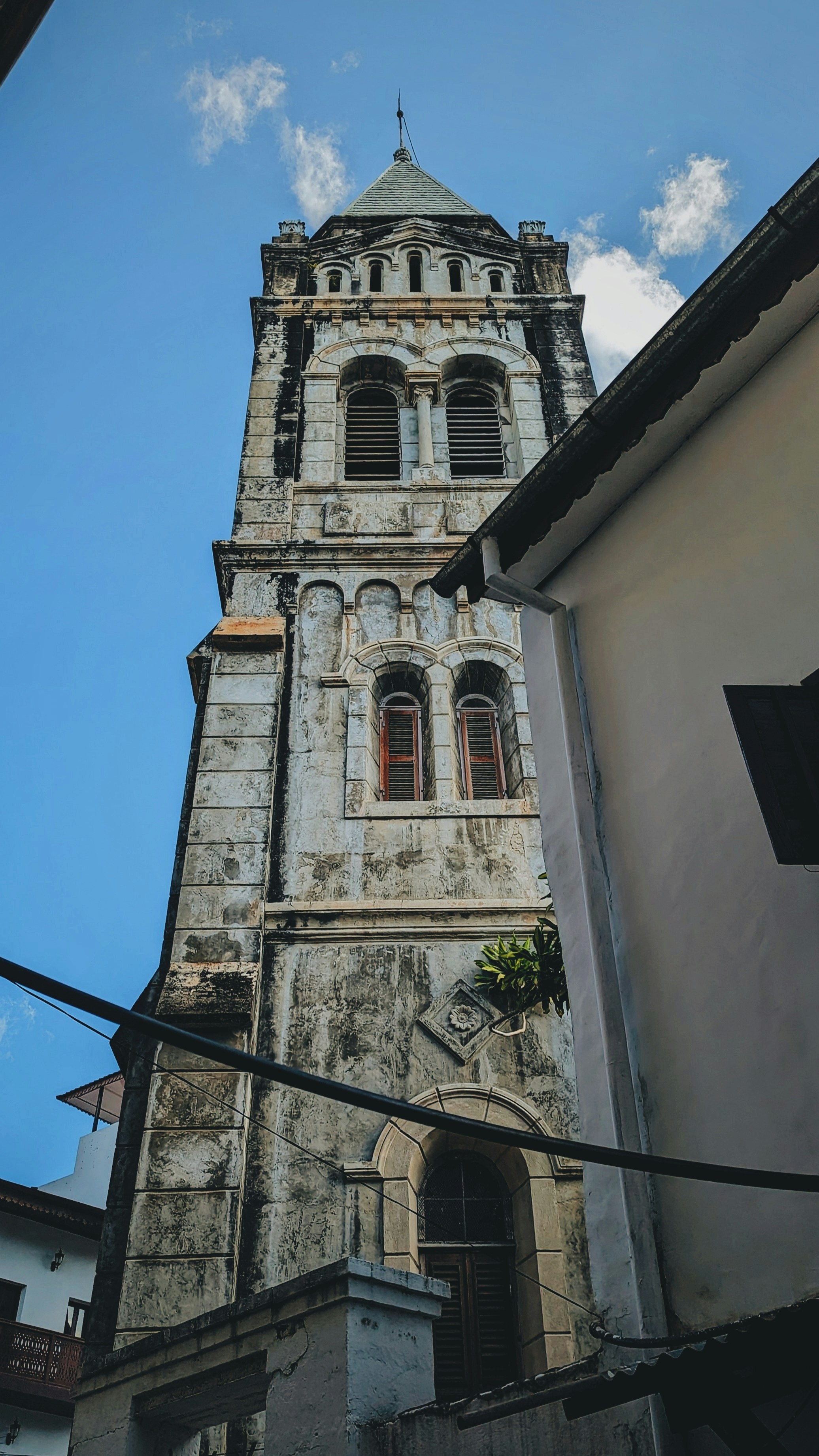 a tall tower with a clock on the top of it