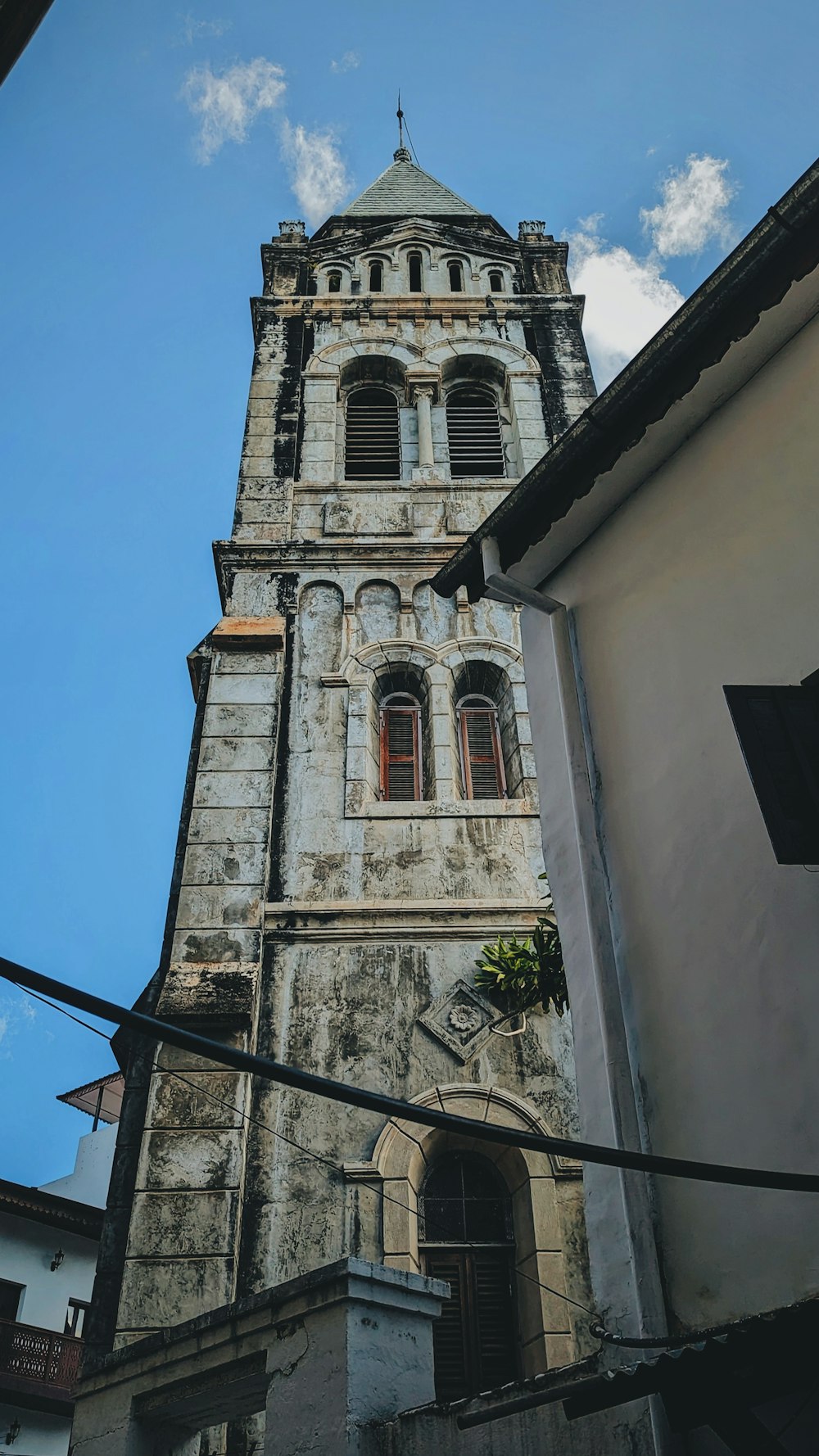 a tall tower with a clock on the top of it