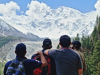 Golden Royal Holidays group posing happily at a scenic viewpoint overlooking the Swiss Alps.