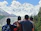 Happy group of friends enjoying a scenic mountain view during a luxury trip.