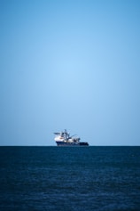 a large boat floating on top of a large body of water