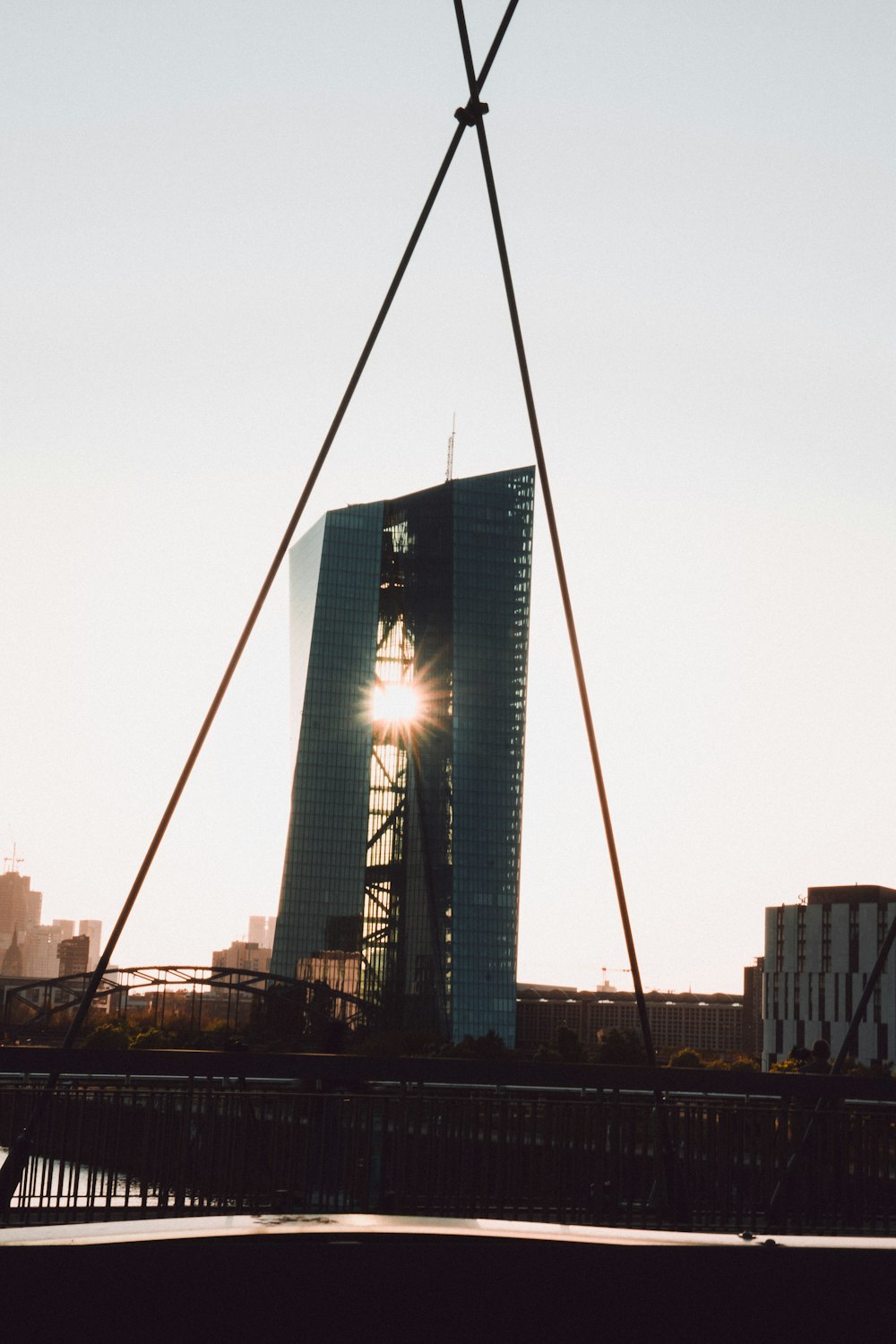 a bridge with a building in the background