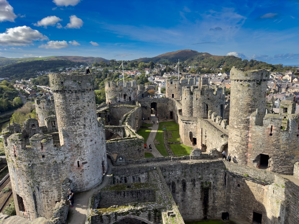 an aerial view of a castle in the middle of a town