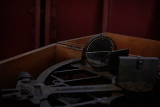 Close-up of an antique sextant against a backdrop of aged parchment.