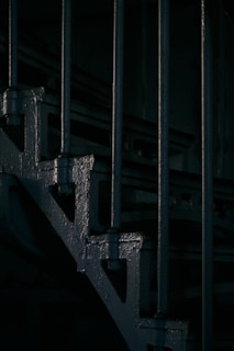 Industrial-style metal railing with raw finish on a loft apartment staircase.