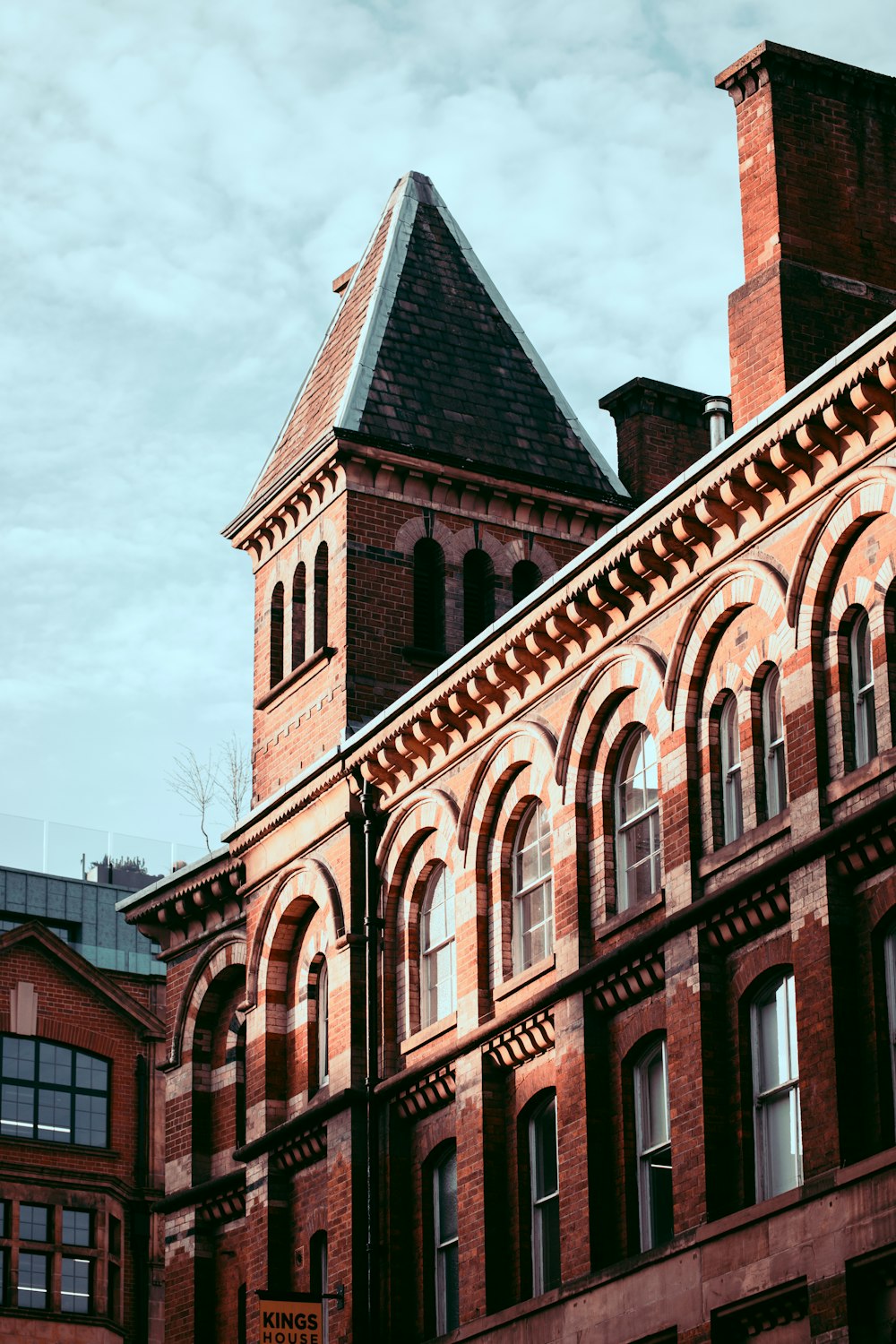 a tall brick building with a clock tower