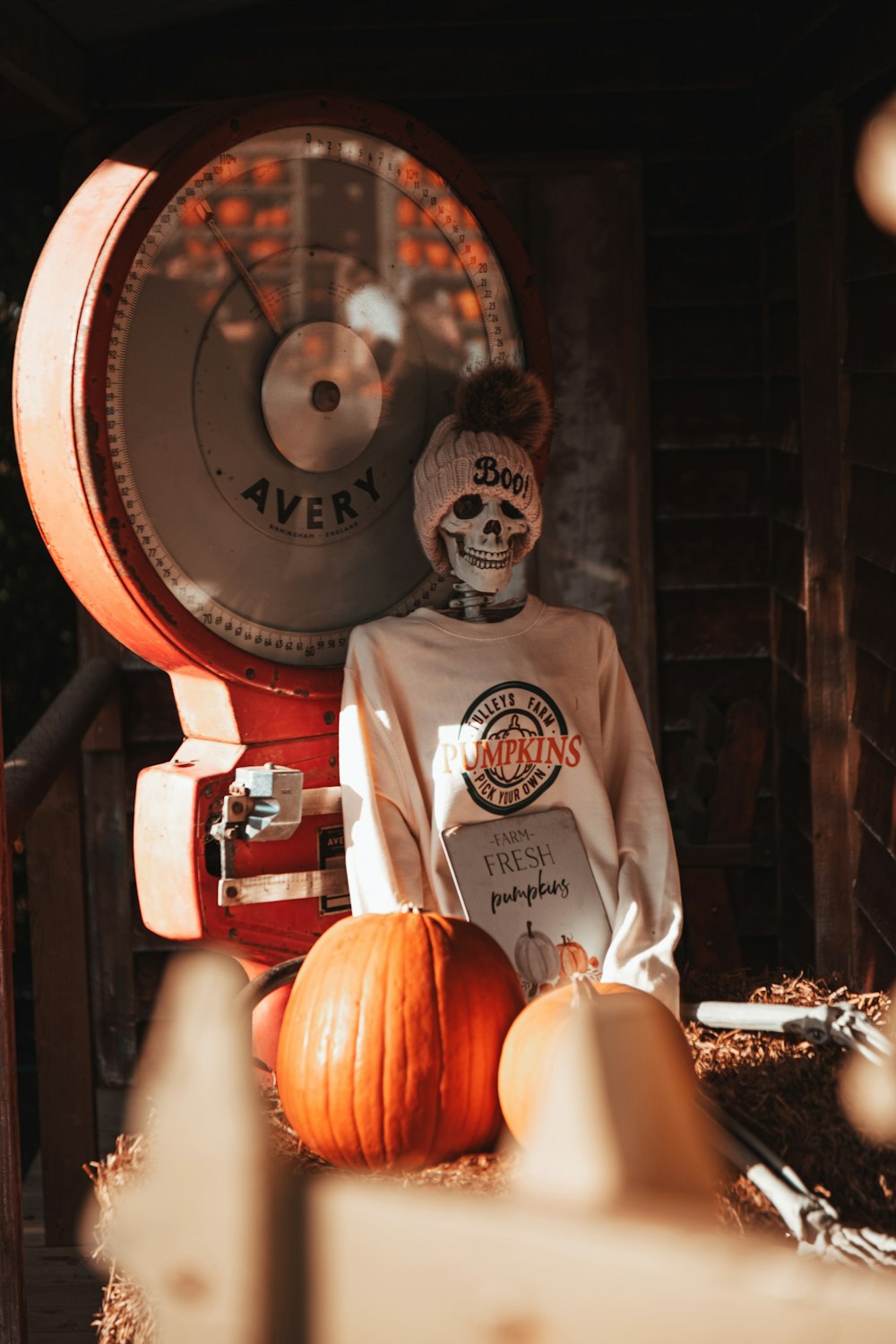 a person with a skeleton face paint sitting in front of a clock