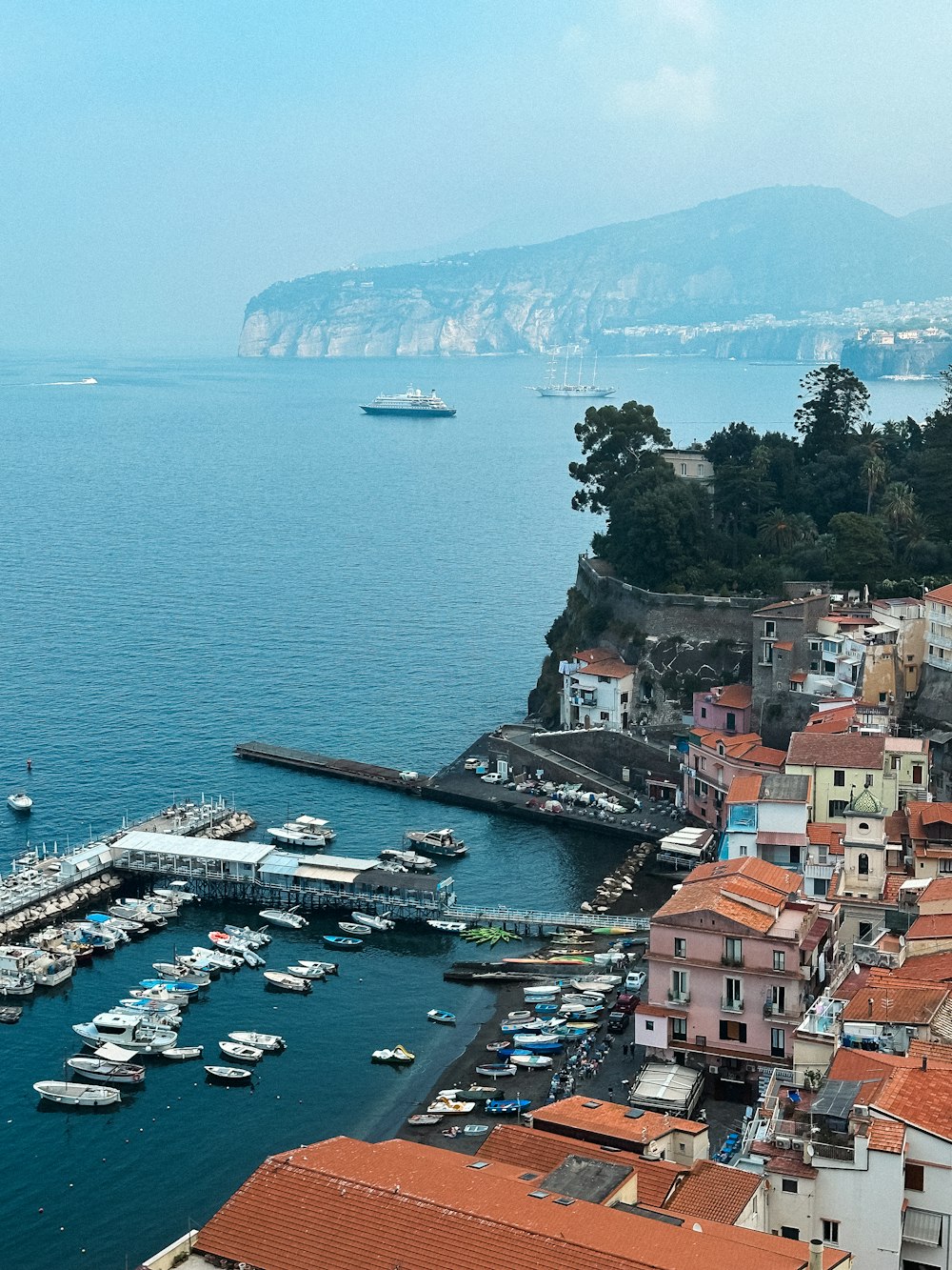 a view of a harbor with boats in the water