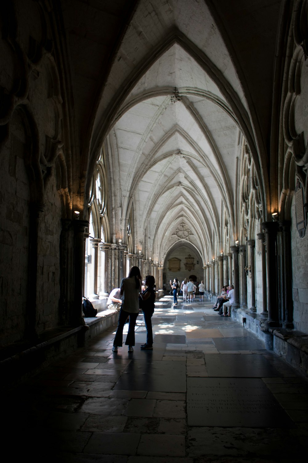 a couple of people that are standing in a building