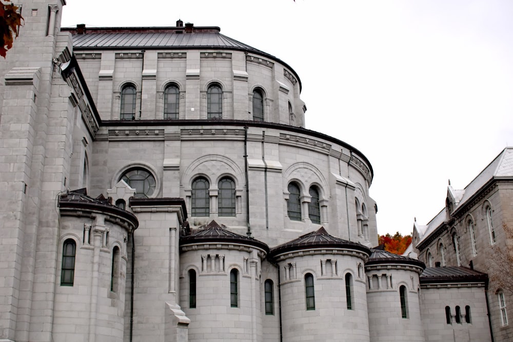 a large white building with a clock on it's side