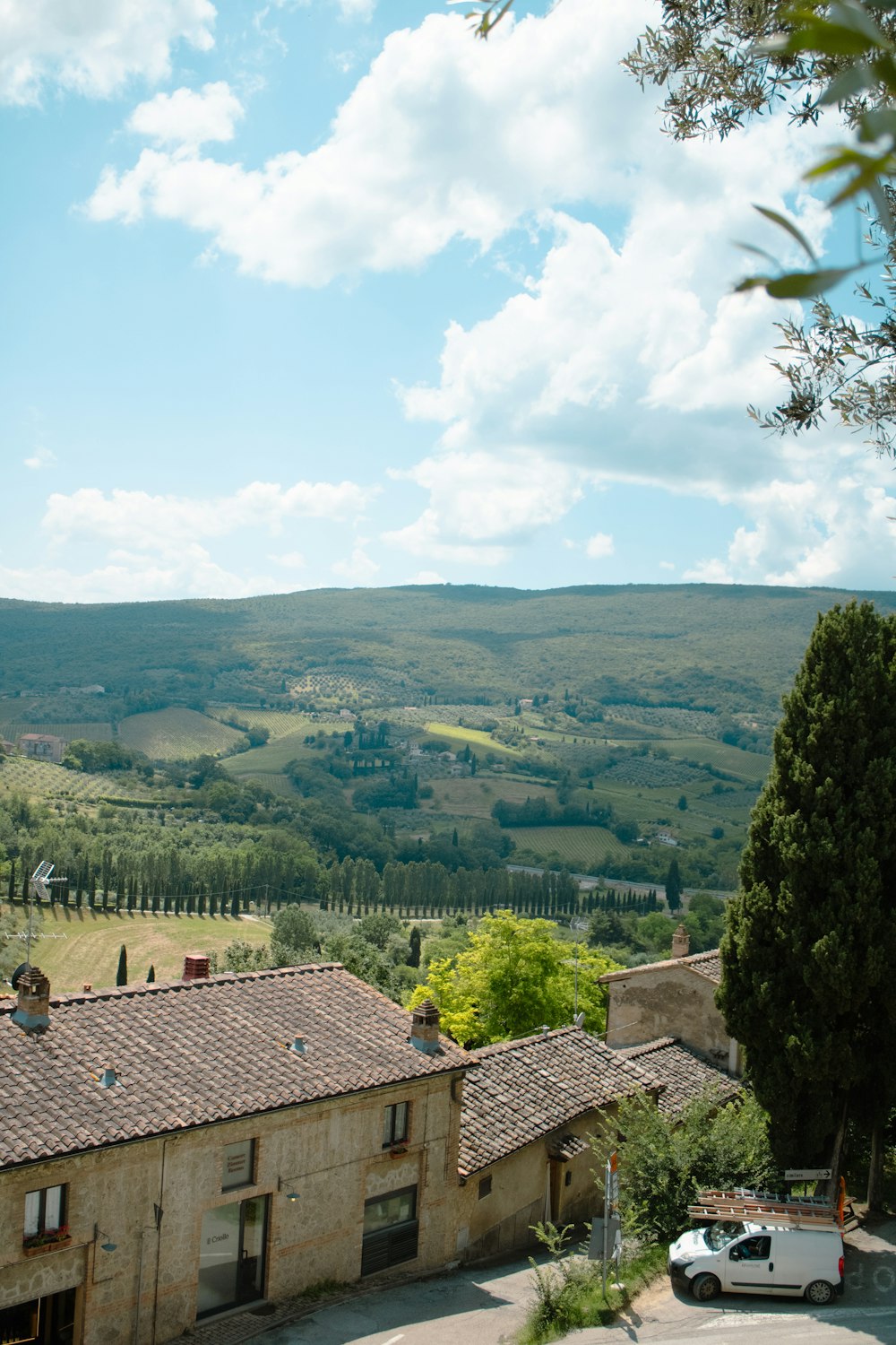 a view of the countryside from the top of a hill