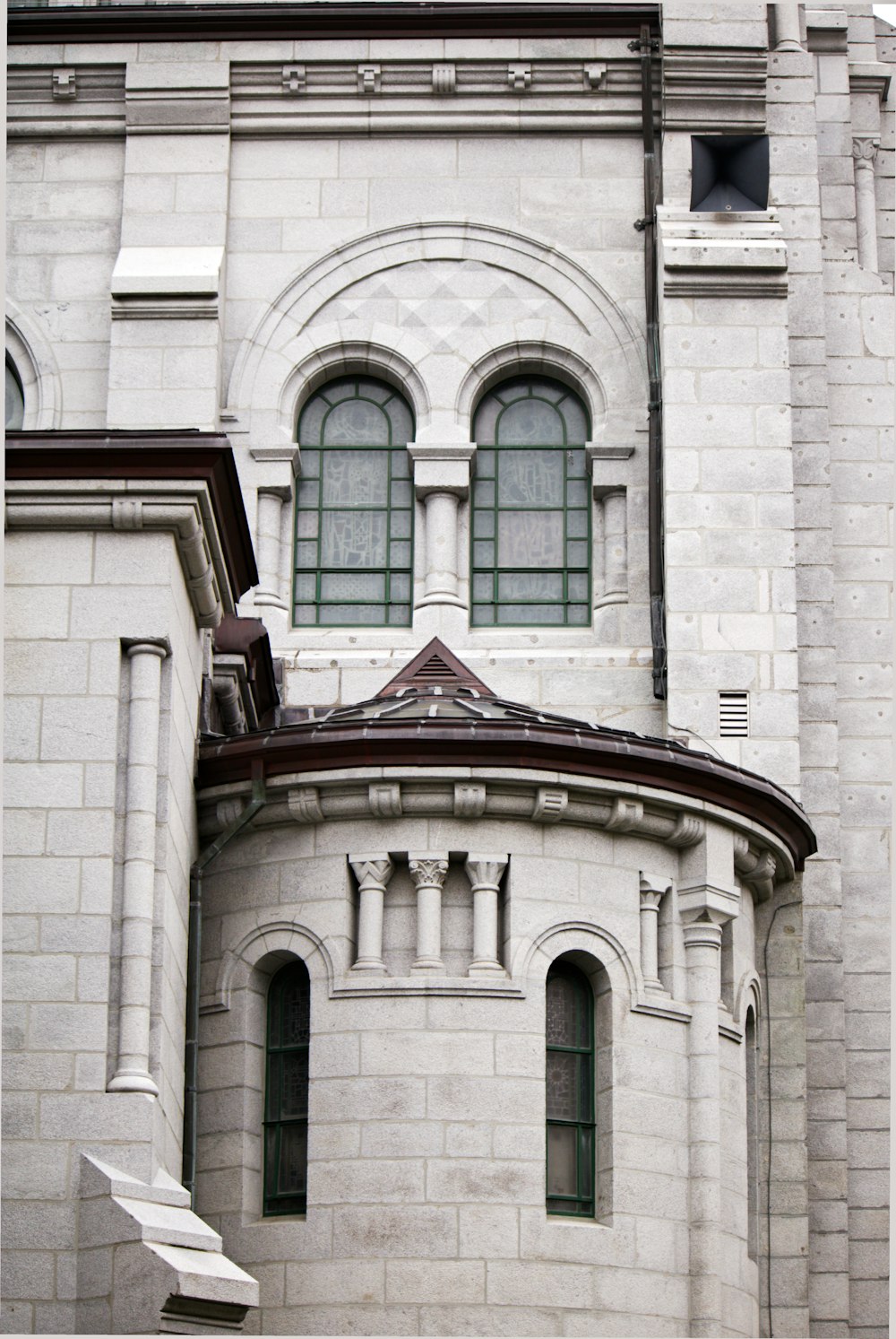 a large white building with a clock on it's side