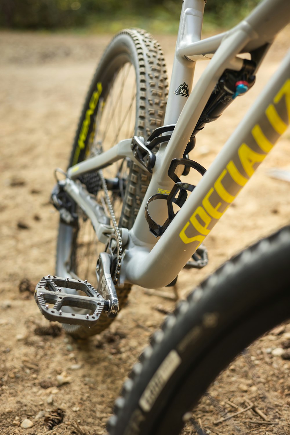 a close up of a bike on a dirt road