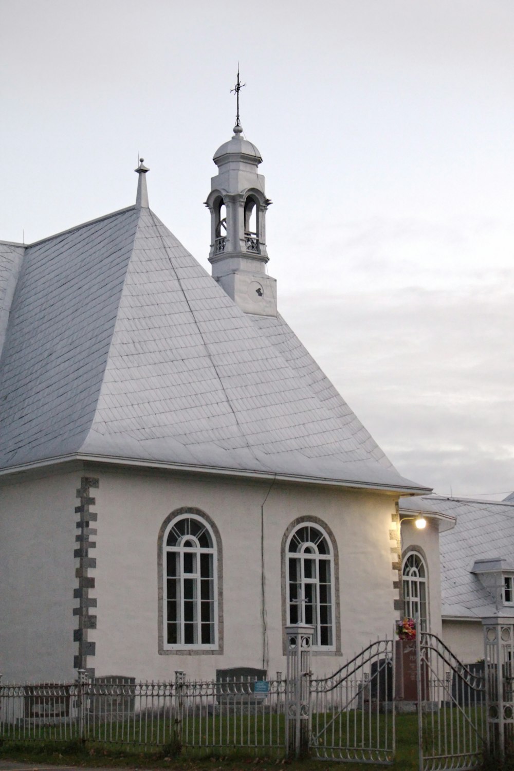 a church with a steeple and a clock tower