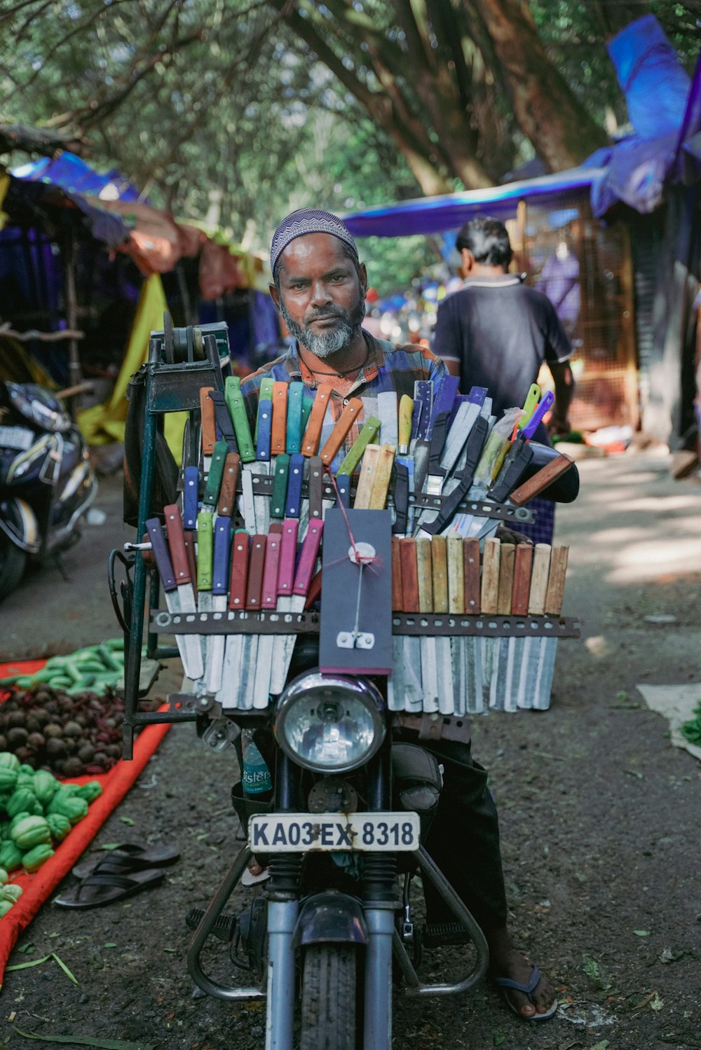 a man on a motorcycle with a basket full of crayons