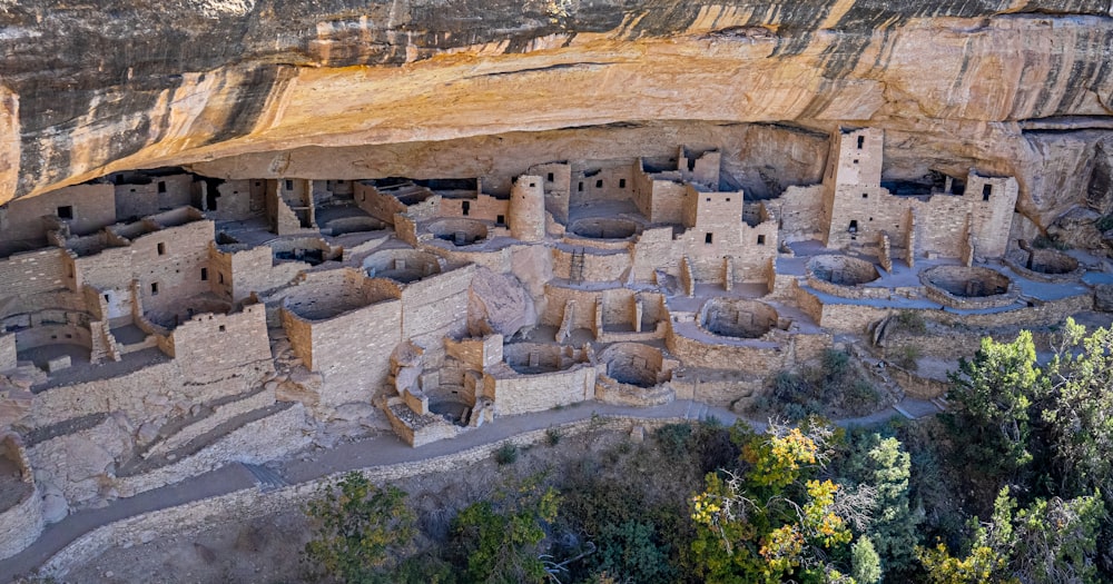 a cliff with a cliff house built into the side of it