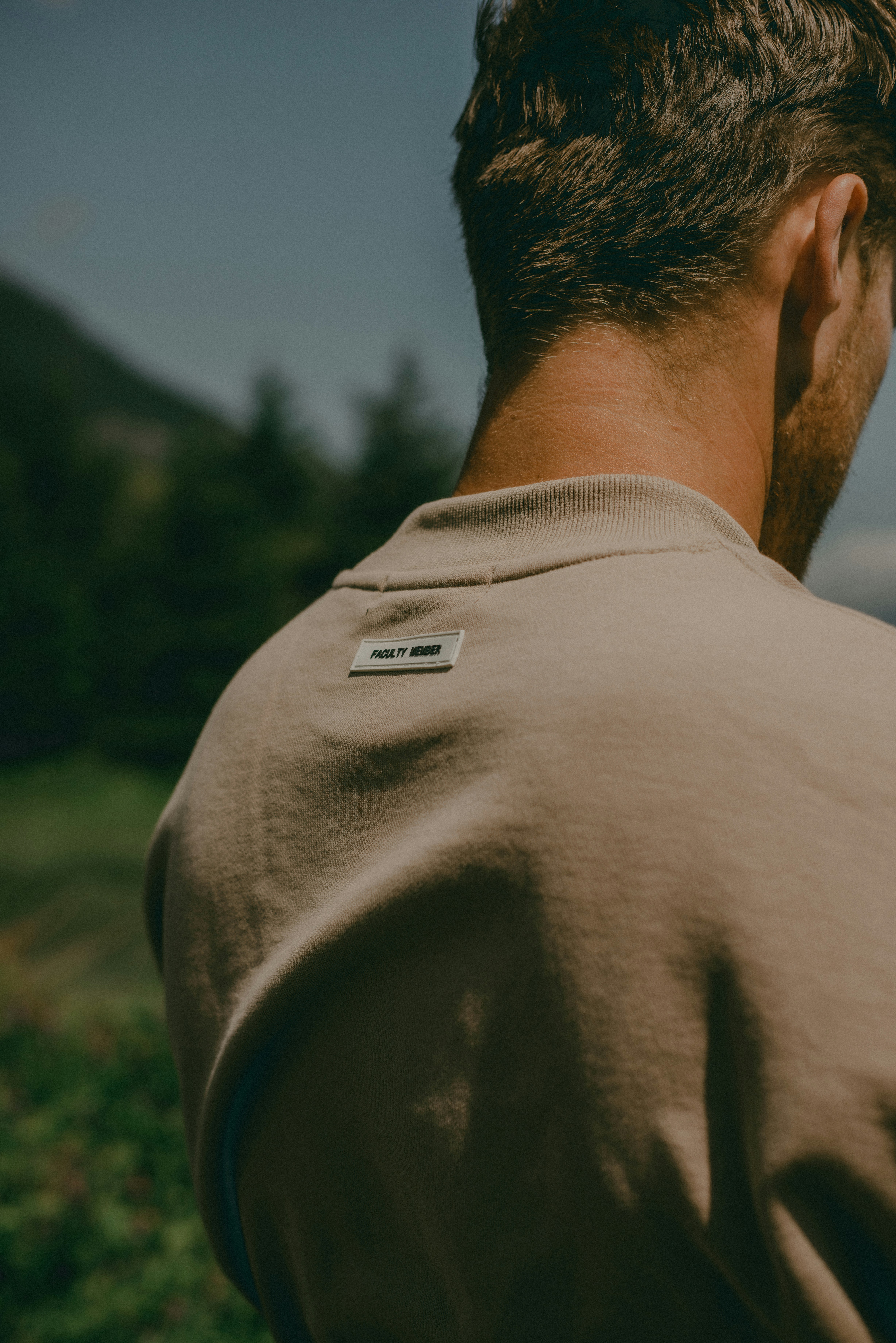 a man with his back turned to the camera
