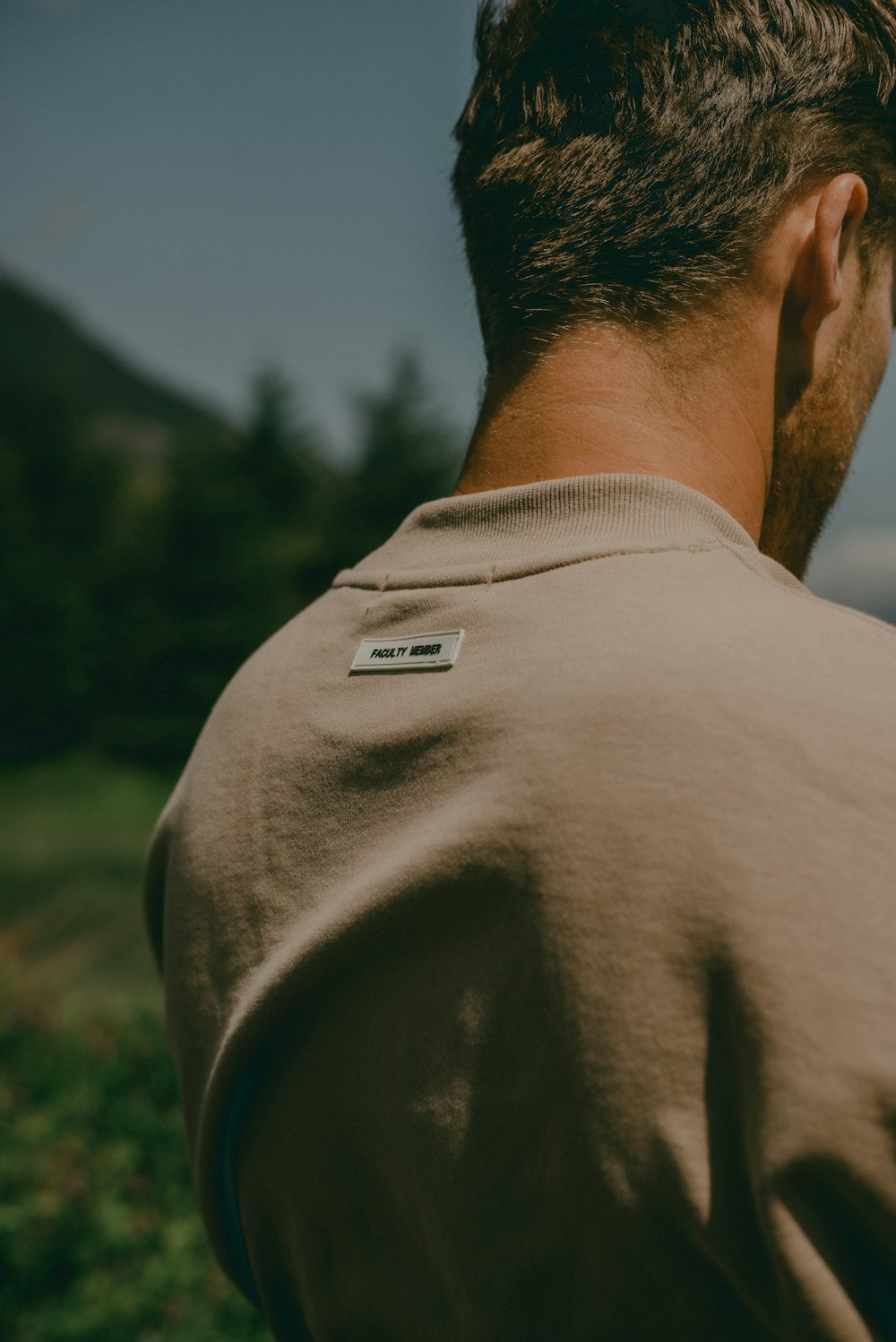 a man with his back turned to the camera