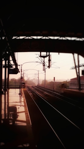 a train station with a train on the tracks