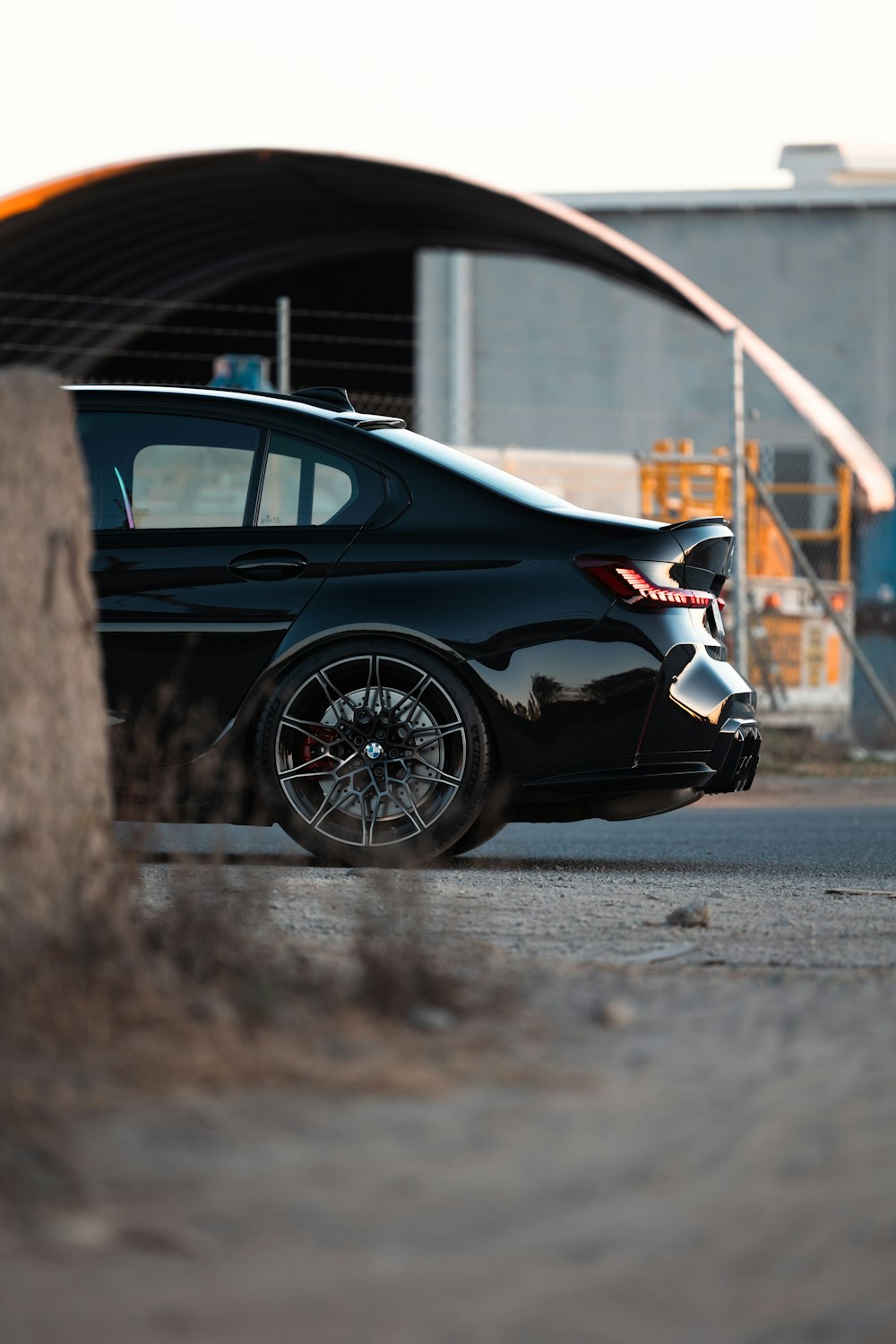 a black car parked in front of a building