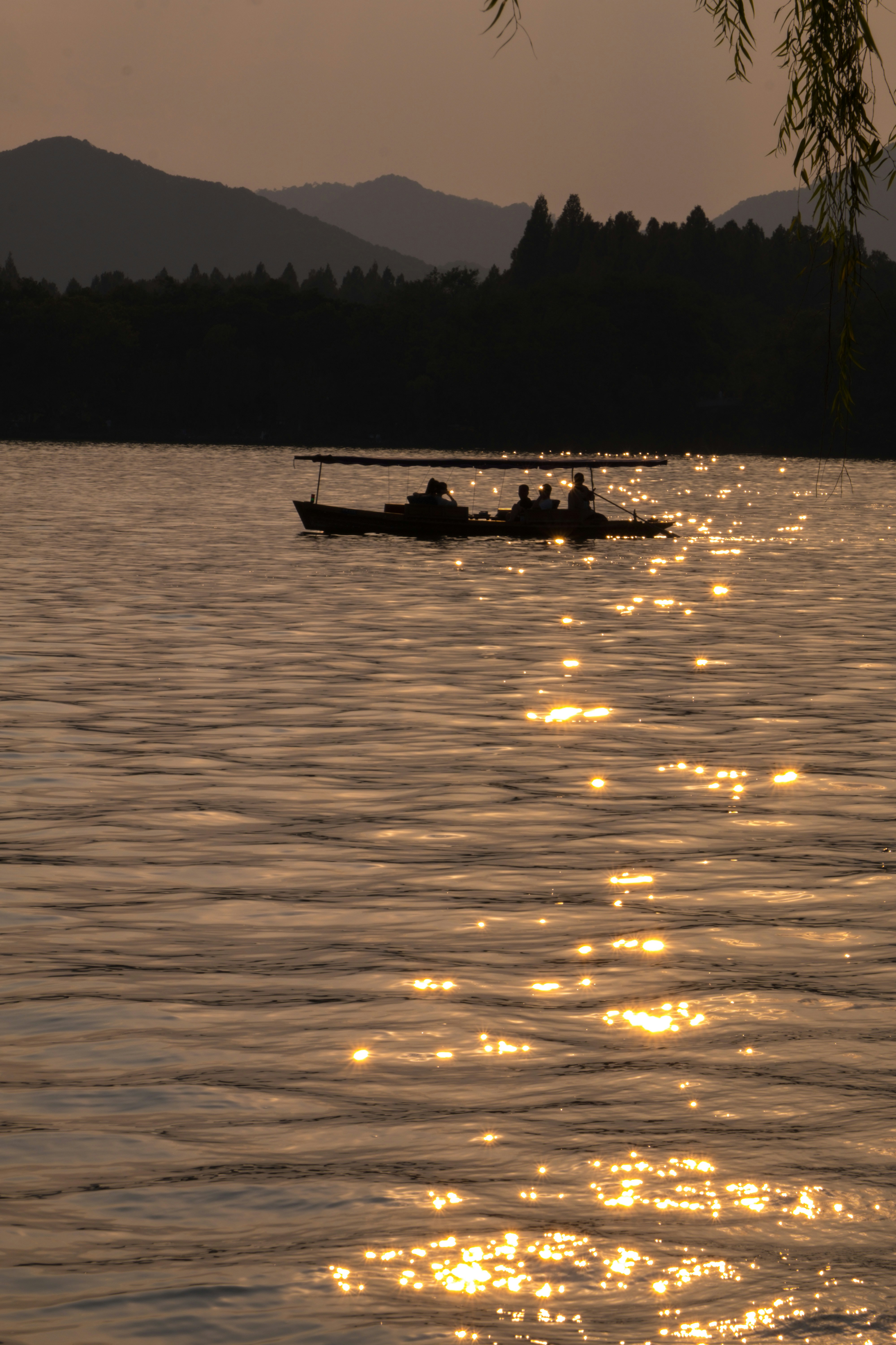 a couple of boats floating on top of a lake