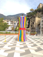 A vibrant shot of Plaza Botero showcasing Fernando Botero's oversized sculptures under a bright sky.