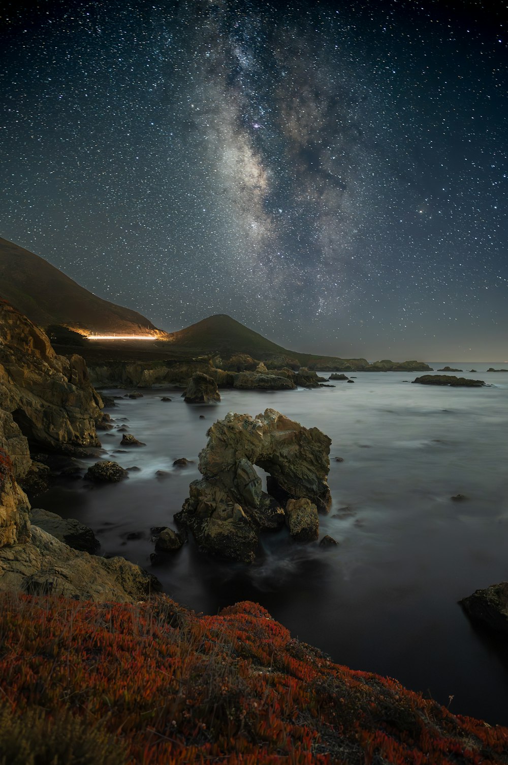 the night sky over a body of water