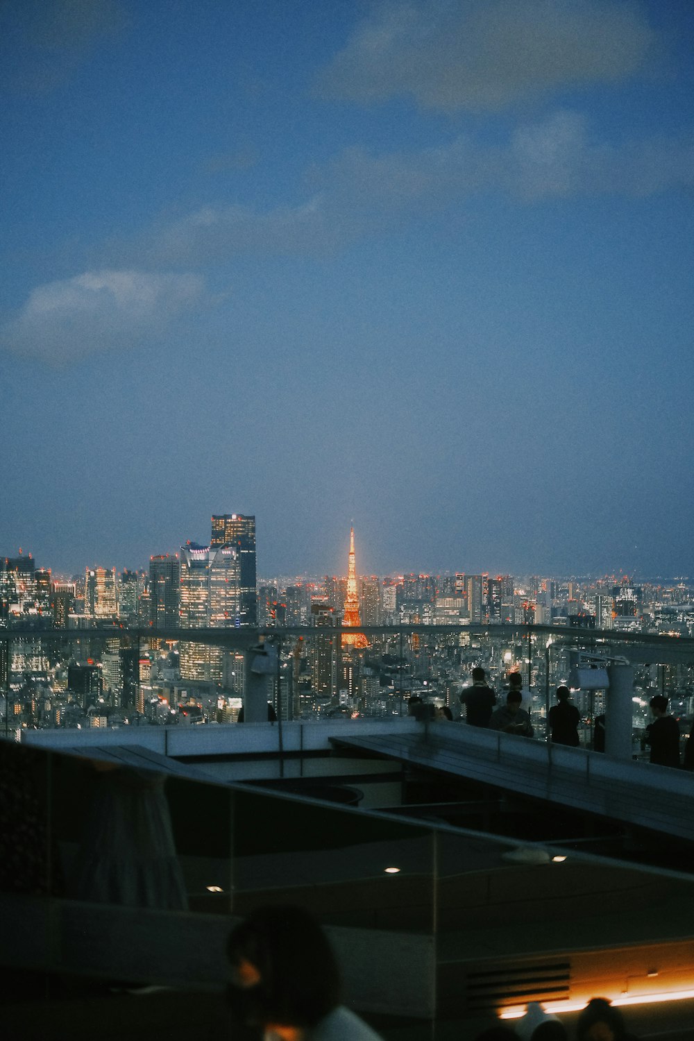 a view of a city at night from a rooftop