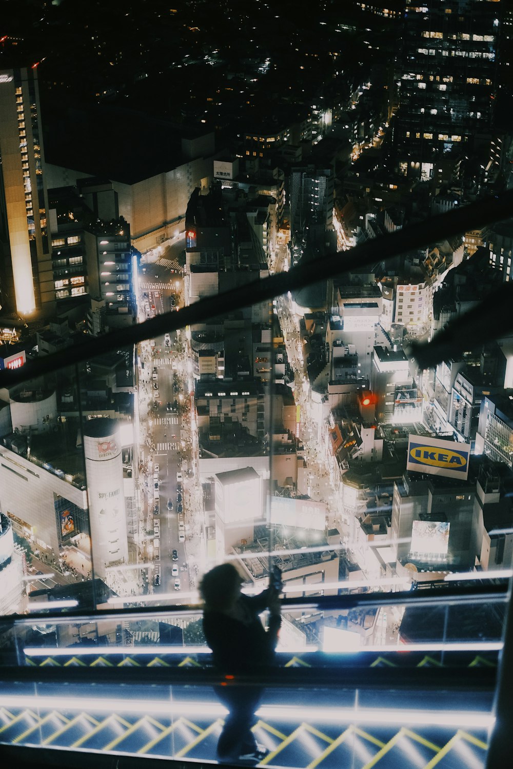 a person standing on top of a tall building