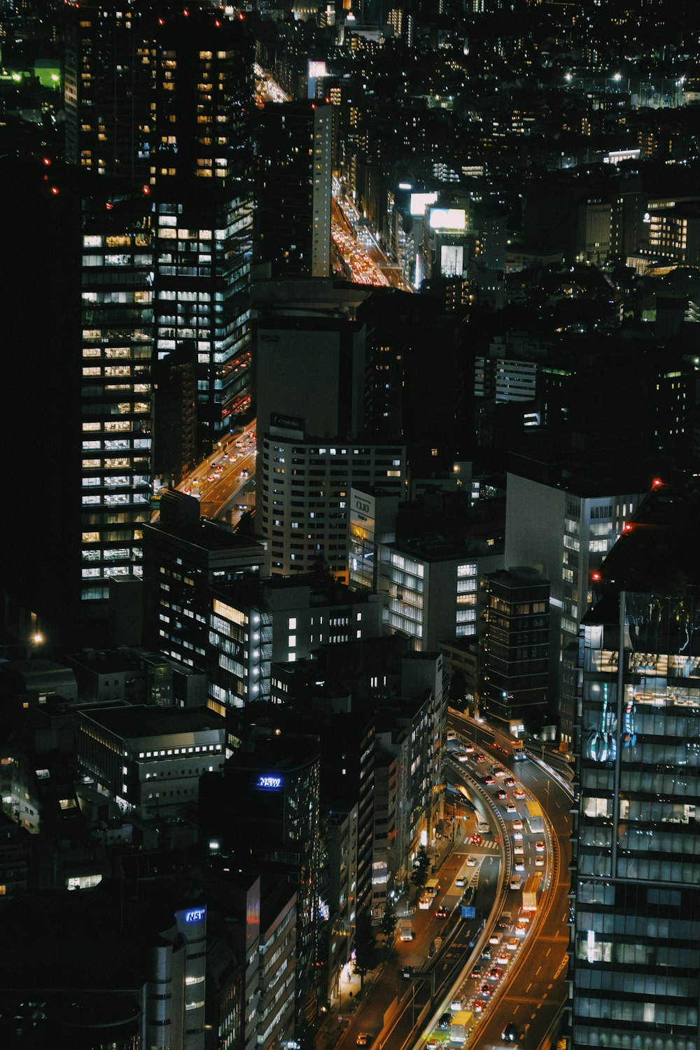 a view of a city at night from the top of a building