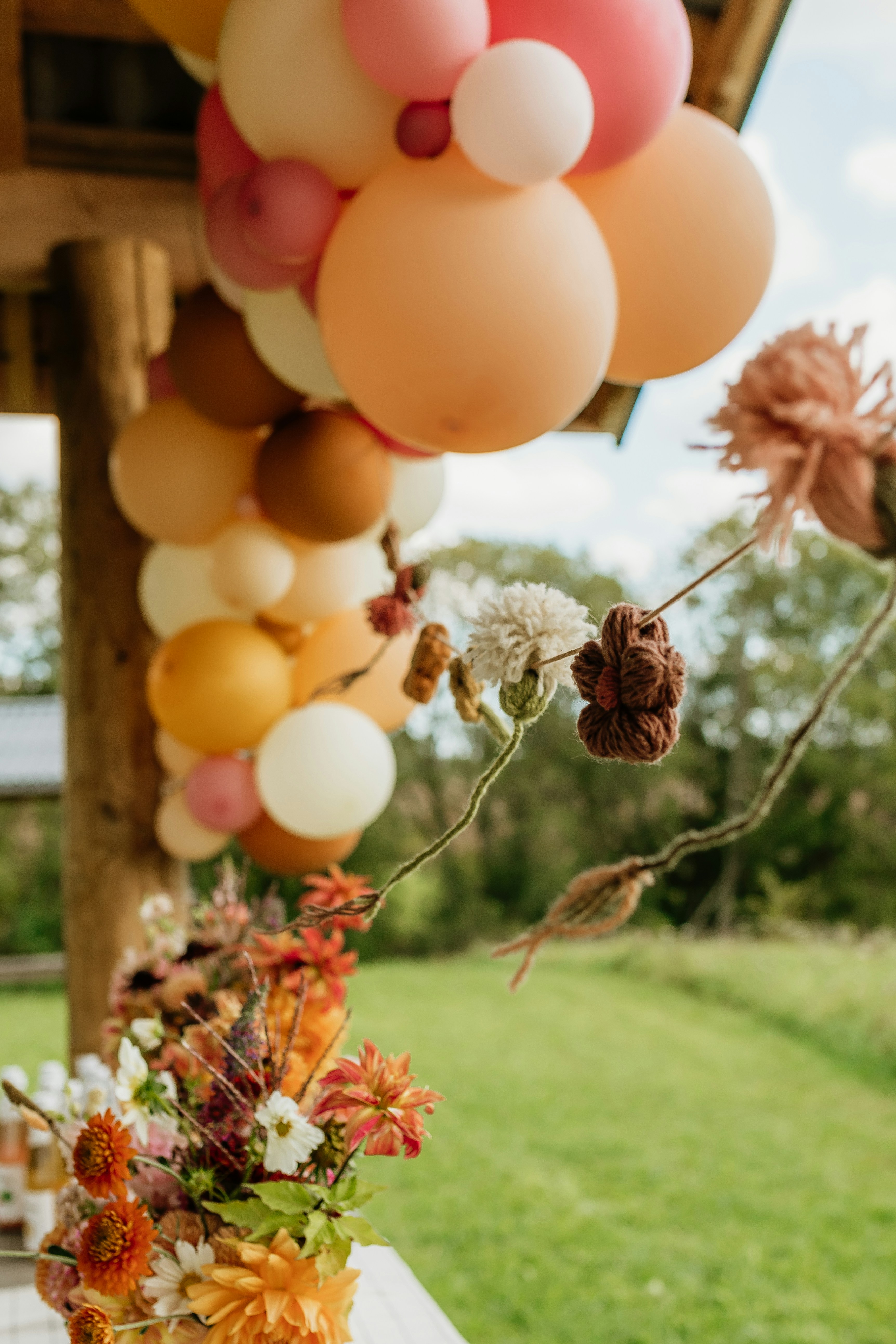 Soft balloon arrangement used as celebration decor around an event space