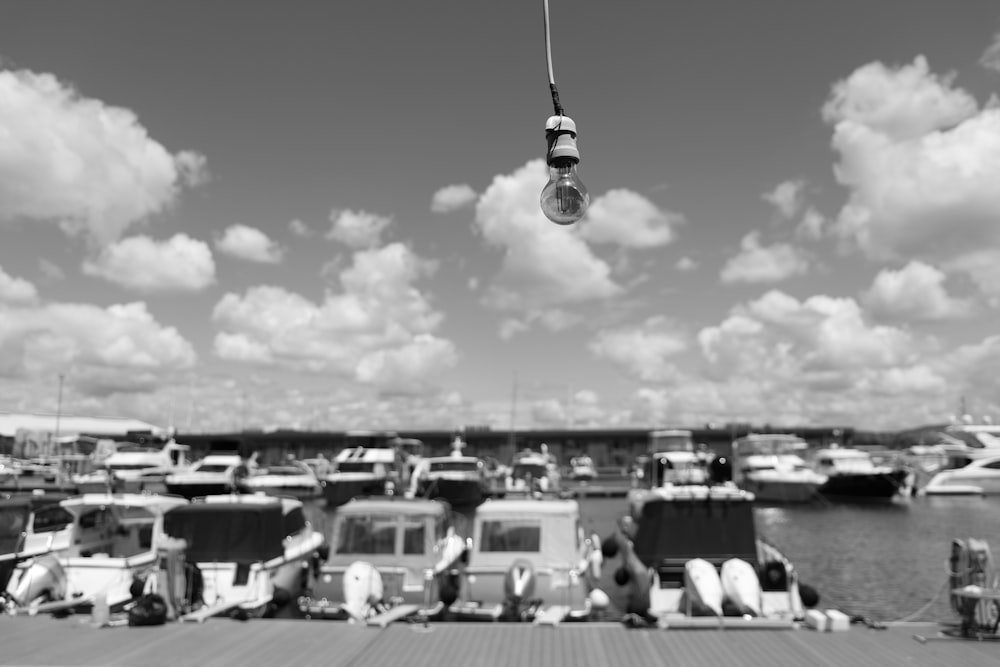 a black and white photo of a boat dock