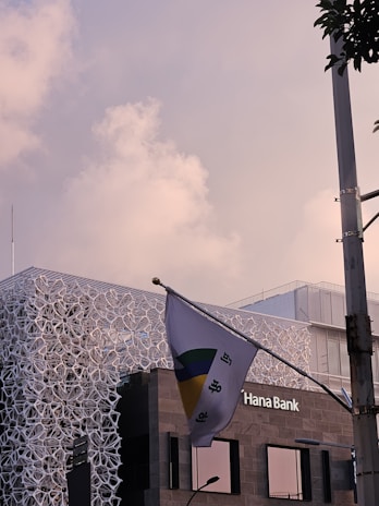 A modern bank building representing the Industrial Bank of Korea.