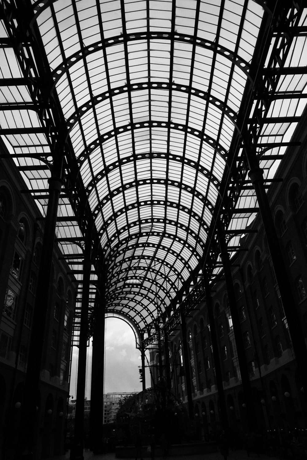 a black and white photo of a train station