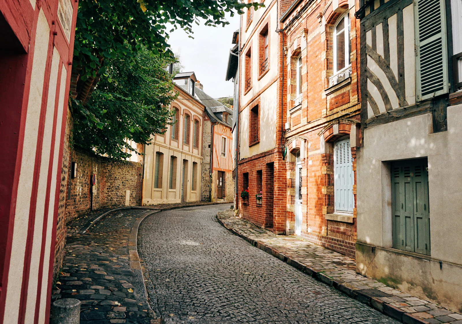 A cobbled street of slate-hung houses — Honfleur, France
