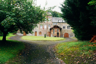 A welcoming historic building in Enon Valley with lush greenery around.