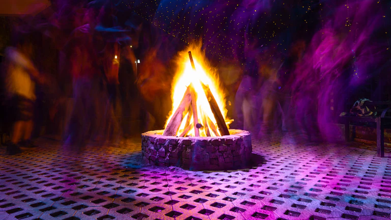 Evening campfire scene with family sharing stories, surrounded by neon and pastel decorations.